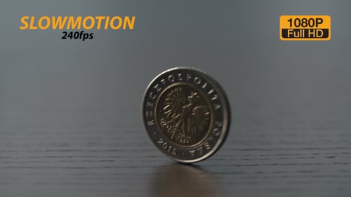 Close Up of Coins Spinning on Table