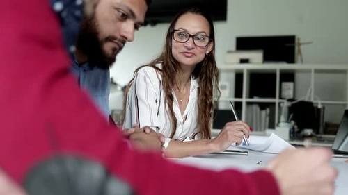 Creative Team Collaborates on Architectural Design in Office