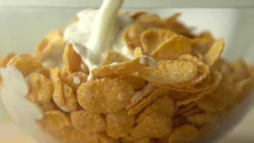 Milk Being Poured into Bowl of Cereal