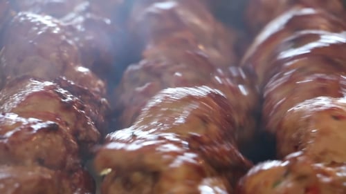 Sizzling Glazed Meat on Skewers Cooking