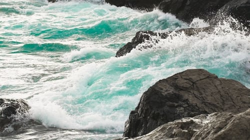Waves Crashing on a Rugged Rocky Coastline