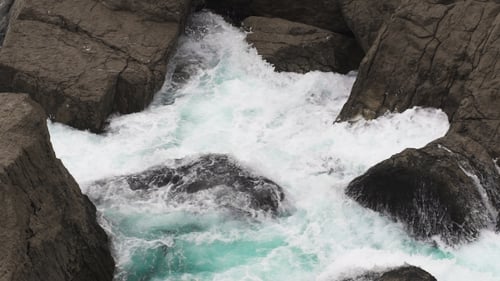 Coastal Waves Crashing on Rocky Shoreline