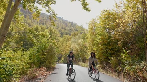 Couple Riding Bicycles Outdoors