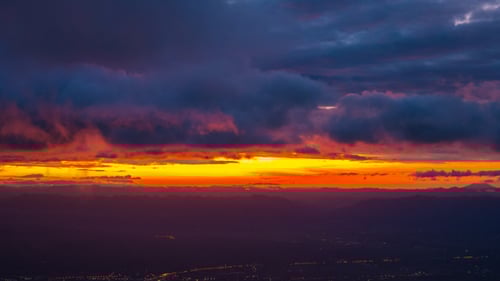 Aerial View of Golden Sunrise over Mountains