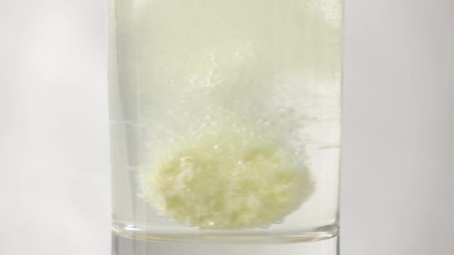Effervescent Tablet Dissolving in a Glass of Water
