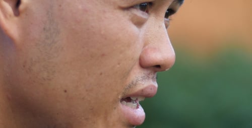 Asian Man Jogger Taking A Break