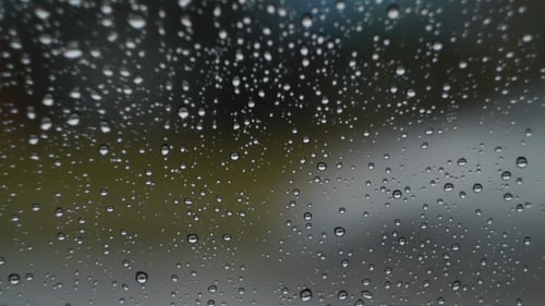 Rain Droplets on Glass Surface Abstract Background