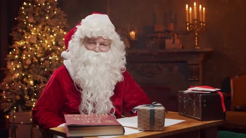 Santa Claus at Desk with Christmas Tree