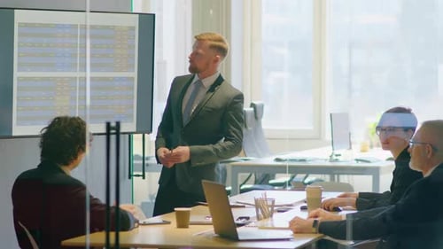 Businessman Giving Presentation at Office Meeting
