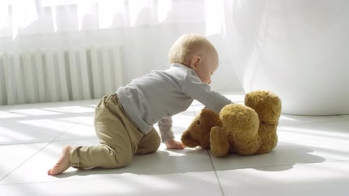 Adorable Baby Crawling Towards Toy