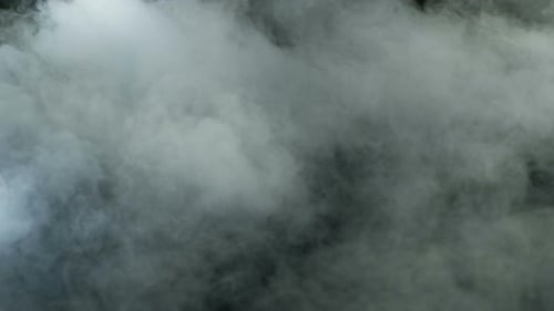 Abstract Fog Billows Across Black Background