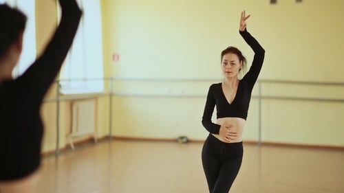 Young Woman Dancing in Studio, Practicing Choreography