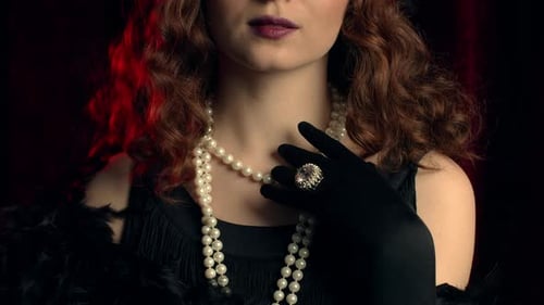 Woman in Flapper Costume with Pearls and Ring