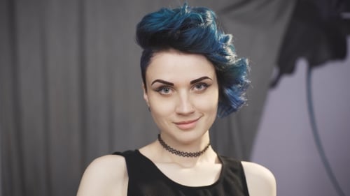 Young Woman with Blue Hair Posing