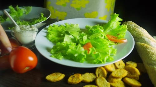 Woman With Beautiful Nail Polish Making Caesar Chicken Salad