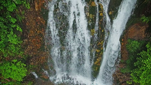 Waterfall In Mountains