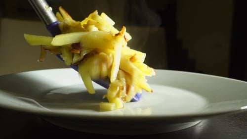 Hot Fried Potatoes on White Plate Indoors