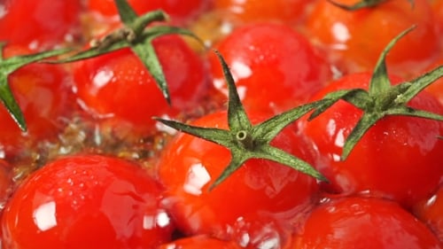 Roasting Cherry Tomatoes With Leaves Shot