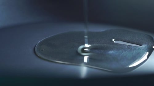 Abstract Liquid Flowing on Gray Background