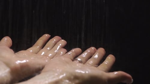 Raindrops Falling Into Hands