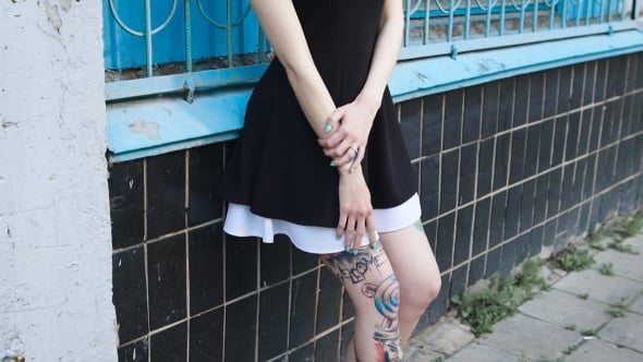 Portrait Of A Punk Girl With Tattooed Feet On The Street Lifestyle portrait-of-a-punk-girl-with-tattooed-feet-on-the-street-lifestyle