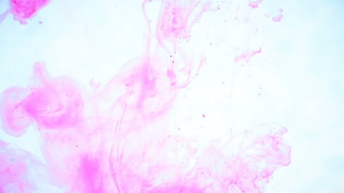 Abstract Pink Ink Dissolving in Water