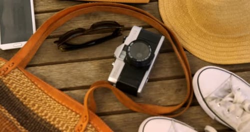 Summer Vacation Accessories Arranged on Wooden Table