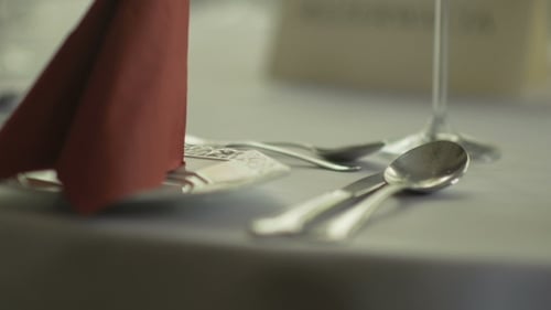 Elegant Table Setting with Silverware and Wine Glasses