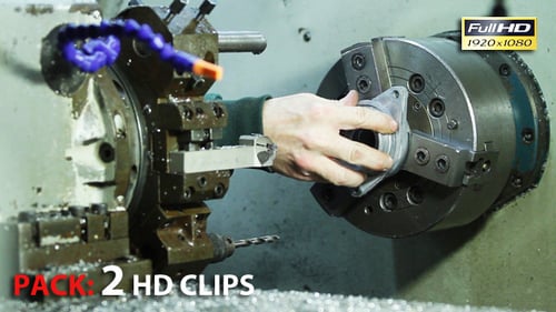 Worker in the Factory Operating a Lathe Machine - Set of 2 Video Clips