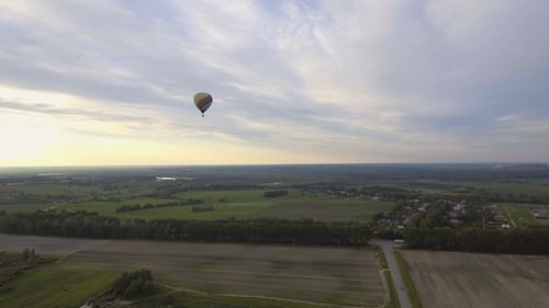 Hot Air Balloons In The Sky Over a field.Aerial View