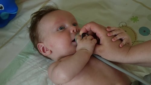 Adorable Baby Examined with Stethoscope Indoors