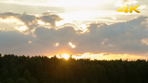 Sunset With Clouds Over The Forest