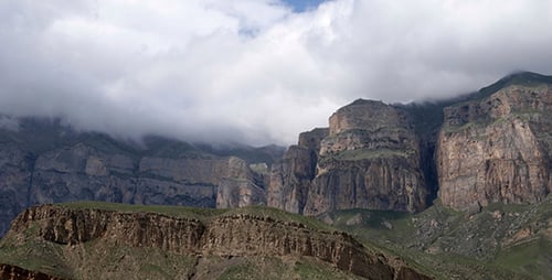Dramatic Mountain Landscape with Clouds Obscuring Peaks