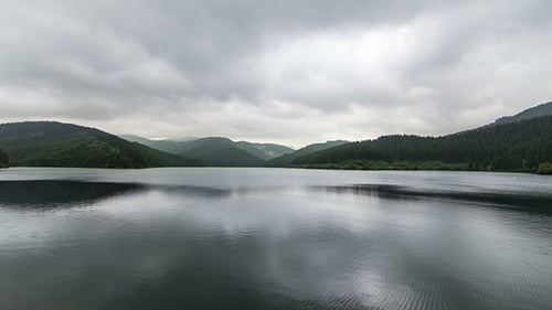 Storm Dark Clouds Over Mountain Lake