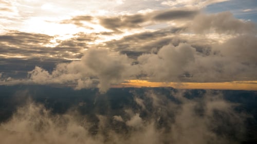 Clouds and Fog Moving Over Mountain
