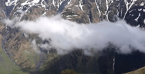 Clouds Flying Between Mountains