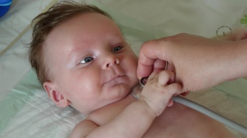Baby Examined with Stethoscope During Doctor Visit