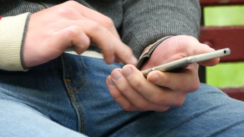 Hands Using Smartphone Device with Touchscreen Technology