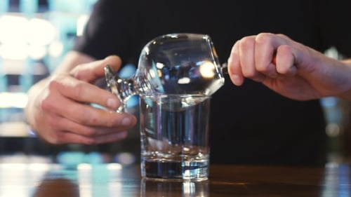Bartender Burning Sambuca At The Bar. Spectacular Cooking Sambuca At The Bar