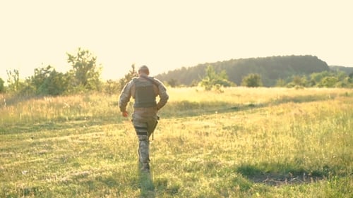 Military Man With Automaton Go Away In The Steppe. Slowly
