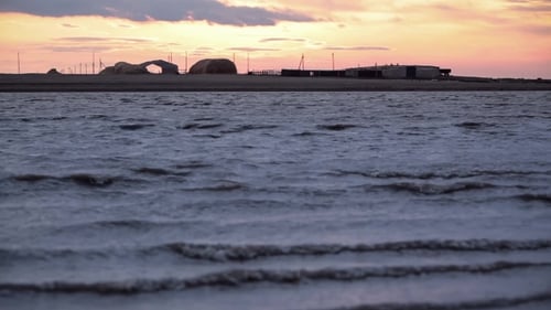Waves on the Lake. Sunset. Farm on the Other Side of the Lake