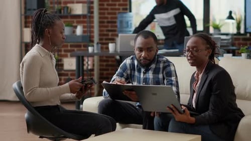 Business People Doing Teamwork to Analyze Sales Statistics