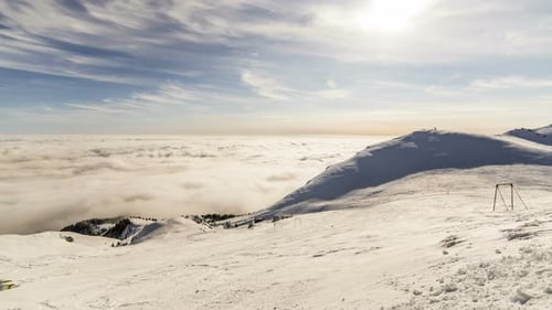 Snowy Mountains and Clouds in Winter Landscape