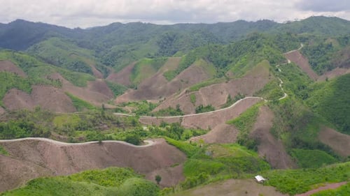 Aerial top view of forest trees and green mountain hill. Nature landscape background, Thailand.