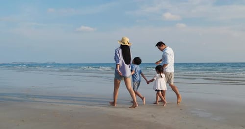 Family walking on the beach