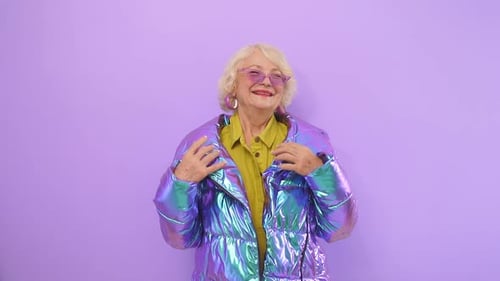 Senior Woman in Iridescent Jacket Posing