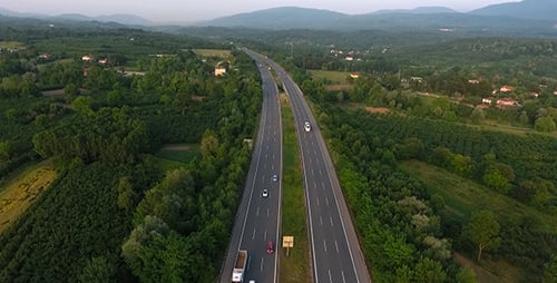 Aerial View of Cars on Highway Surrounded by Forest