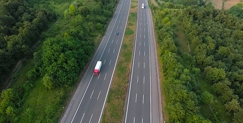 Aerial View of Highway Through Green Countryside