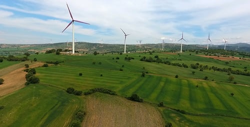 Wind Turbines on Green Rolling Hills Aerial