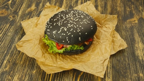 Gourmet Black Burger on Brown Paper